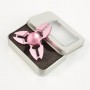 Vaaleanpunainen alumiininen tri-spinner stressilelu.