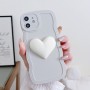 iPhone 12 sydän suojakuori rannerenkaalla.