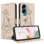 Honor 90 Lite suojakotelo toimii tukevana jalustana ja sisällä näkyy kolme korttipaikkaa
