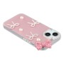 iPhone 14 kuoren pinkki rusetti ja helmikoristeet tuovat puhelimeen näyttävyyttä.