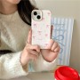 iPhone 14 kuoren pinkit rusetit tuovat puhelimeen hempeän ilmeen.